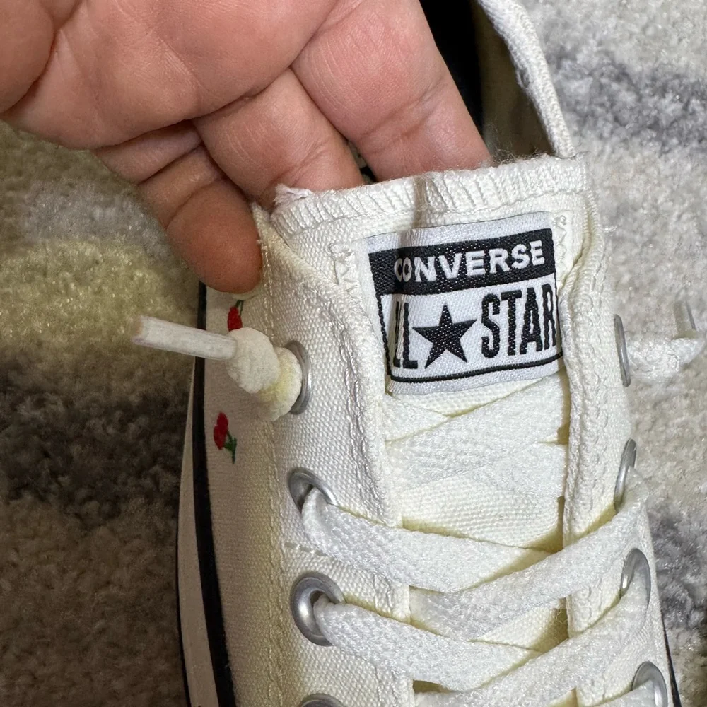 Converse White Canvas Low-Tops with Red Accents